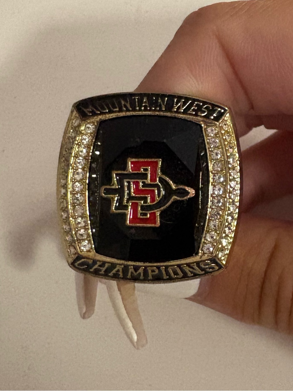 Mountain West Champions Ring with Red and Black Logo